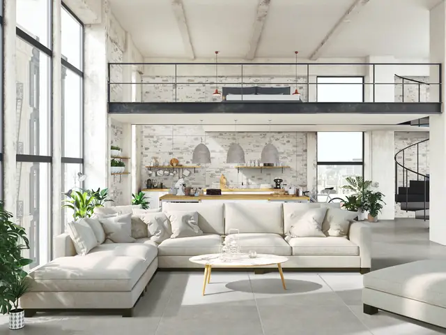 Loft avec un sol en grès cérame gris, exemple de carrelage italien en déstockage